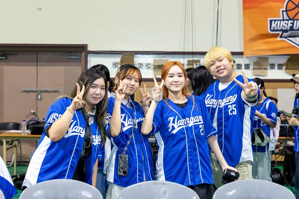 Participants from around the world wear matching uniforms and take a group photo at the hiss opening ceremony venue.