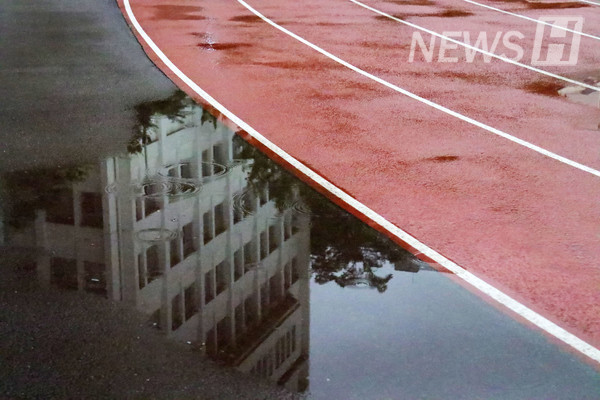 ▲ Puddles form across the main sports field.